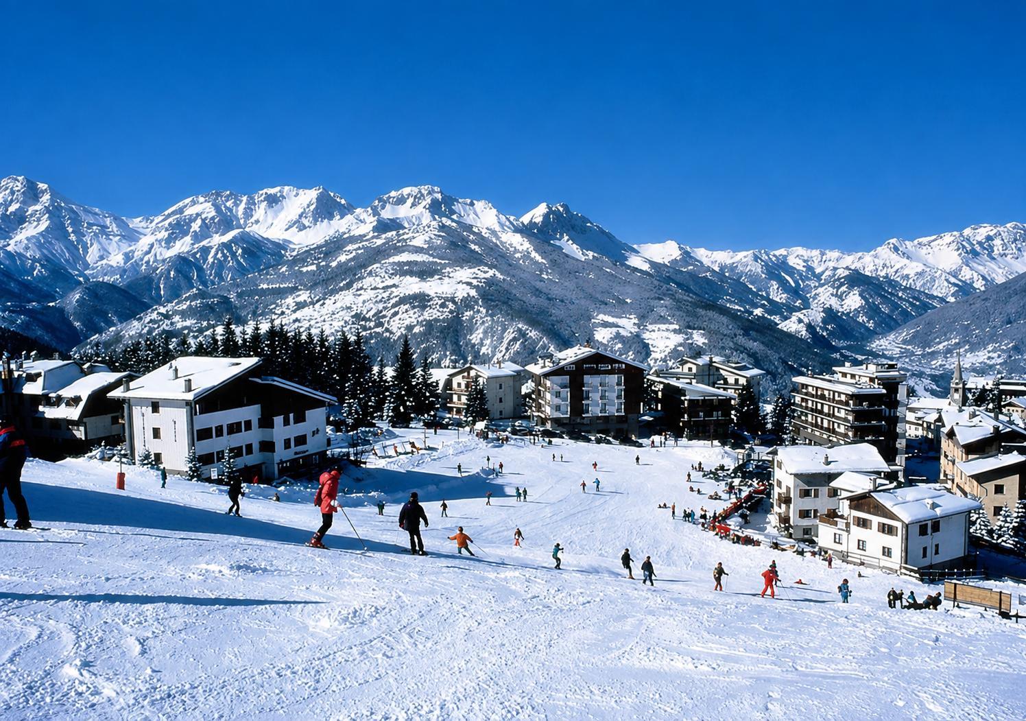 Sauze d'Oulx in the snow with ski lifts towards the mountains