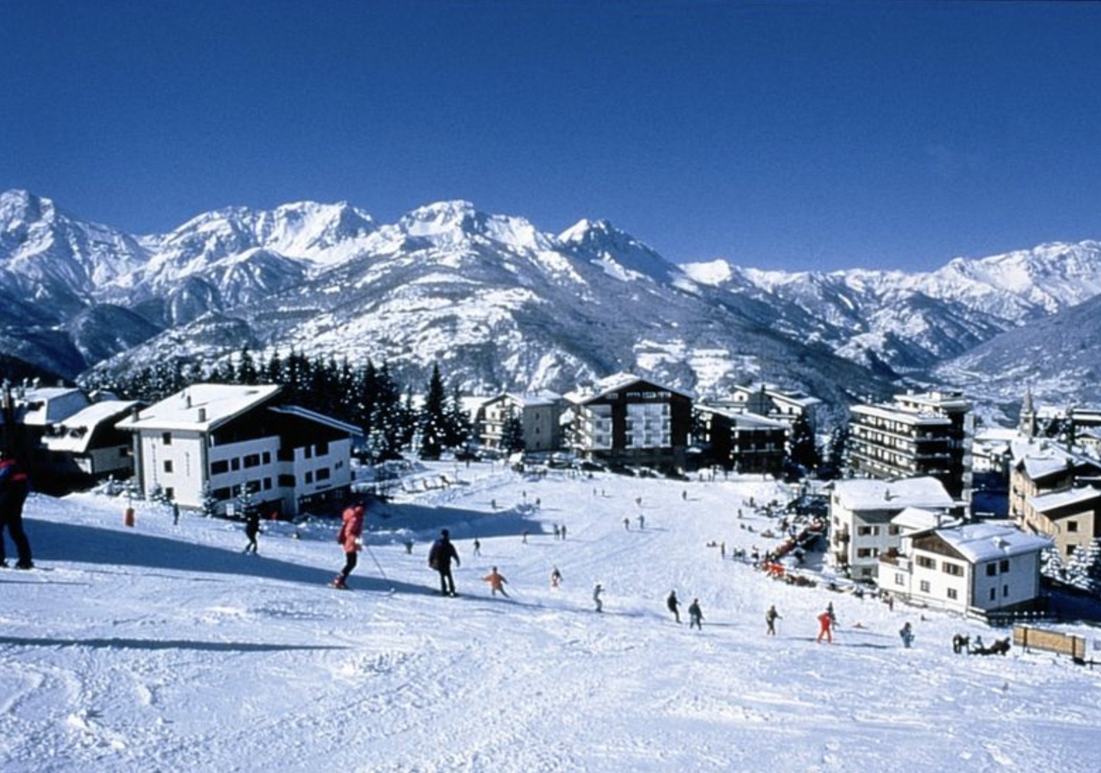Sauze d'Oulx in the snow with ski lifts towards the mountains